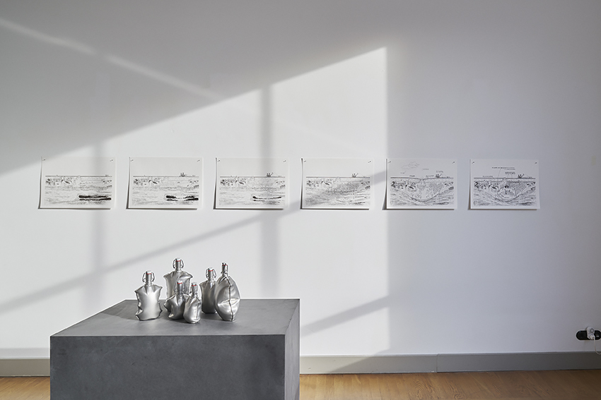 Water bottles by Henriëtte Waal and silkscreened prints with coal by Jenny Stieglitz. Photo: Johannes Schwartz.