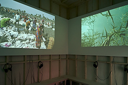 Inside the video pavilion by Monadnock. Left: <i>Deep Weather</i> by Ursula Biemann, right: <i>Sloot</i> by Koos Buist. Photo: Johannes Schwartz.